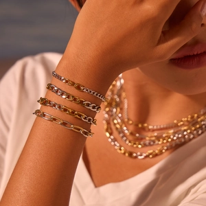 Modieuze goud- en zilverkleurige ketting en armband set van gepolijst staal design