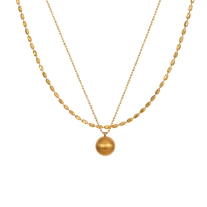 Minimalist double-layered gold bead chain necklace with a large matte gold ball pendant