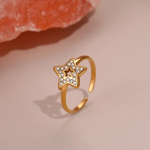 Detail of gold star ring with micro-set crystals and adjustable opening band