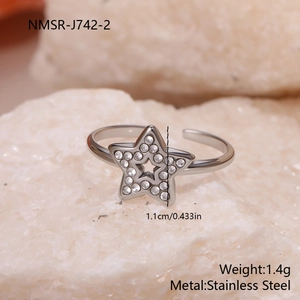 Detail view of adjustable star ring in stainless steel with crystal pavé settings