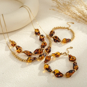 Conjunto de joyas de acero chapado en oro 18K con cuentas de resina de leopardo
