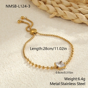 Detail of adjustable golden stainless steel bead bracelet with square zircon centerpiece