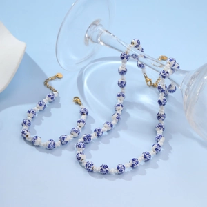 Blue and white floral ceramic bead necklace and bracelet set with golden lobster clasp