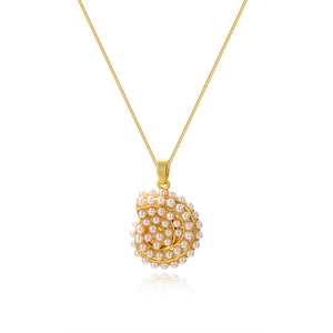 Close-up of spiral shell pendant in 18k gold plating featuring clustered white pearls