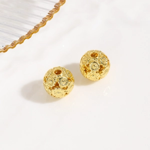 Detalle de cuentas de linterna huecas doradas de 10mm con relieve de girasol para joyas
