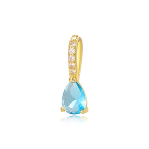 Macro shot of 18k gold plated pear-cut light blue zircon pendant with pave details