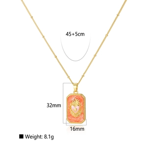Golden tarot pendant necklace with pink heart and sunburst charm on delicate bead chain