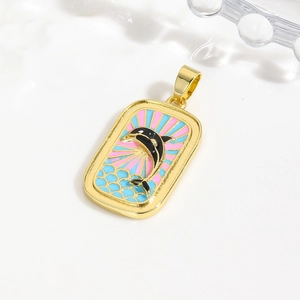 Elegant gold pendant with enamel dolphin and ocean sunburst design in tarot card style