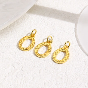 Three gold oval pendants with quilted texture and 18k plating for jewelry making