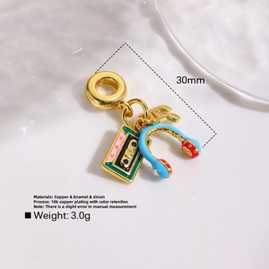 Vintage gold music pendant set with enamel headphone, note and tape charms