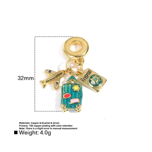 Travel theme charm with gold airplane, enamel suitcase, and passport in 18k gold plating