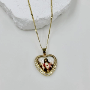 Golden heart necklace featuring Sacred Heart of Jesus with white zircon stones