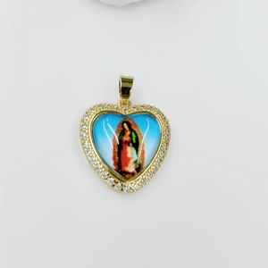 Macro view of heart-shaped Virgin Mary pendant with gold frame and cubic zirconia