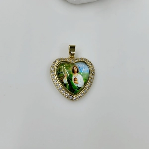 Detailed close-up of heart-shaped Virgin Mary pendant with gold finish and zircon stones
