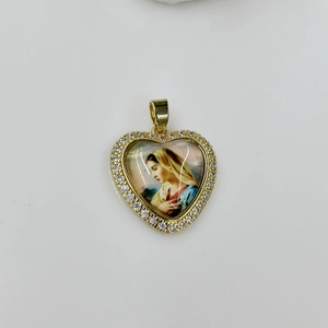 Detail of a heart-shaped gold necklace pendant featuring Mary and white zircon stones