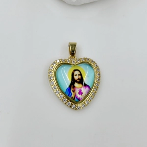 Macro view of heart-shaped Virgin Mary pendant with gold plating and white zircon inlay