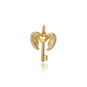 Exquisite gold key pendant with angel wings and heart design featuring fine crystals