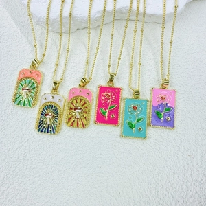 Set of six colorful enamel tarot square pendants with rose and mushroom motifs on gold chains