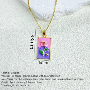 Detail of mushroom and rose pendant with 18K gold plated copper and enamel