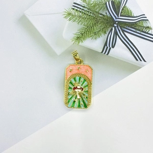 Golden tarot style pendant with red mushroom and stars design on white gift box