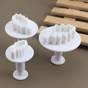 Set of 3 white leaf-shaped cookie cutters with spring-loaded press for baking DIY