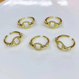 Set of five gold-plated open rings featuring elegant pearl accents and hand-holding design