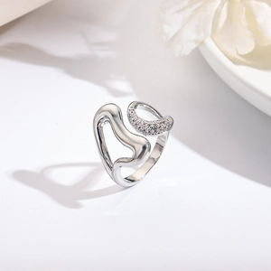 Detail of 18k silver plated irregular heart ring with white zircon pave setting