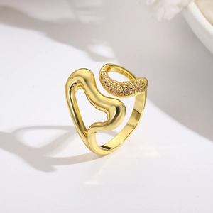 Macro detail of irregular 18k gold plated heart ring with micro-pave cubic zirconia