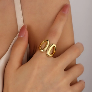 Detail shot of irregular gold double ring with crystal micro-pavé on index finger