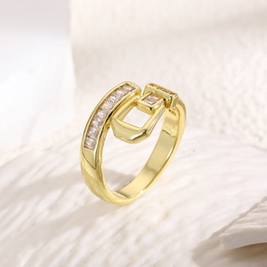 Detailed macro view of gold plated belt buckle ring with rectangular zircon inlay on band