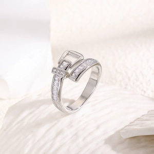 Close-up of belt buckle ring featuring silver-plated metal and square-cut cubic zirconia