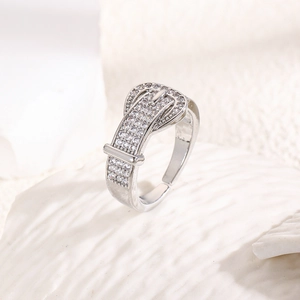 Detailed macro view of silver belt buckle ring with micro-pave cubic zirconia crystals