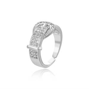 Macro detail of silver adjustable belt buckle ring with sparkling pavé cubic zirconia