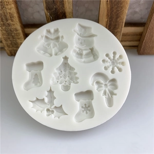 Christmas themed silicone mold featuring snowman, tree, and snowflake for DIY cake decorating