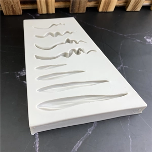 White silicone mold for fondant and chocolate featuring 8 unique wave leaf textures