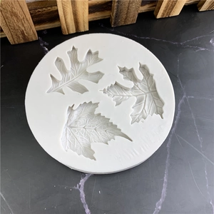 White silicone leaf mold with detailed vein textures for fondant and chocolate baking