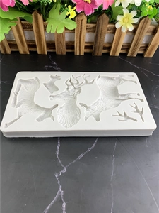 White silicone mold featuring multiple reindeer patterns for DIY fondant and chocolate baking