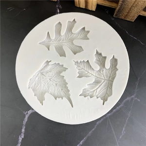 White silicone leaf mold with three detailed foliage patterns for DIY baking and crafts