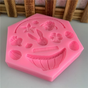 Pink silicone mold with rabbit, flower, and star shapes for fondant cake decorating