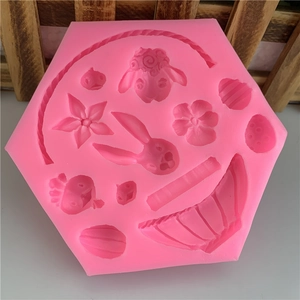 Pink silicone mold with rabbit, sheep, and carrot shapes for fondant cake decorating