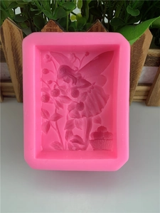 Pink silicone mold featuring an embossed flower fairy with wings for DIY soap making