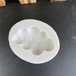 Mini smiling cloud silicone mold for handmade soap and fondant cake decorations
