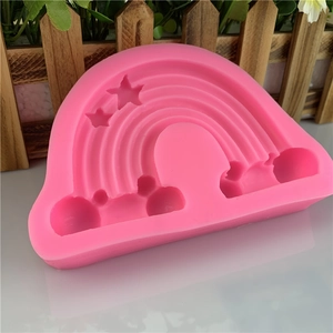 Pink silicone mold featuring rainbow, stars and clouds for baking and DIY crafts