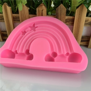 Pink silicone mold with rainbow cloud and star shapes for baking and DIY crafts
