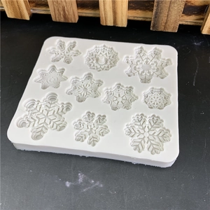 White silicone snowflake mold with 10 cavities for cake decorating and chocolate DIY