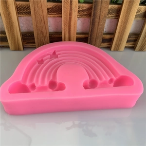 Pink silicone mold with rainbow, clouds, and stars for chocolate, fondant, and DIY crafts