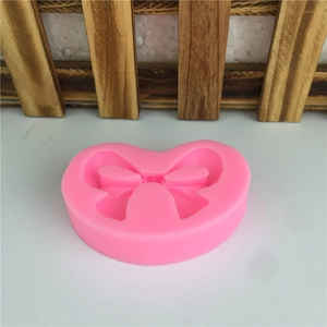 Pink bow-shaped silicone mold for DIY cake fondant, chocolate and baking crafts