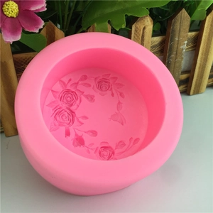 Pink silicone cake mold with rose flower and bow patterns for DIY baking and handmade soaps
