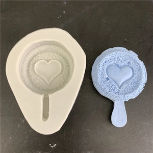 Detail of a heart-shaped silicone mold with honeycomb texture for DIY chocolate making