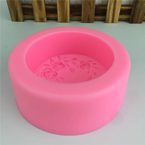 Pink round silicone mold with three detailed rose flower patterns for DIY soap and cake